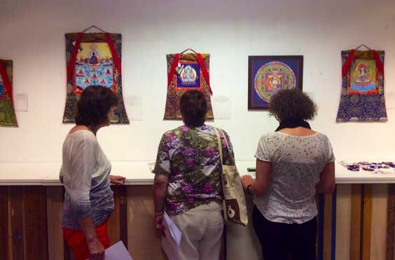 Art lovers looking at the artworks by Carmen Mensink at her thangka exhibition